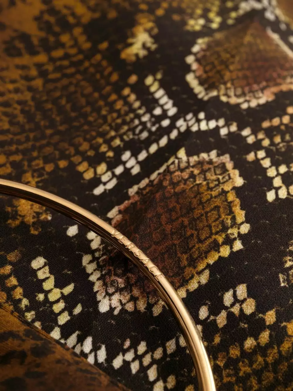 Versace Python print ring embellished trousers 9 Versace python print ring-embellished trousers