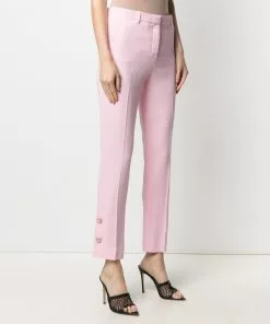 Versace button-embellished skinny trousers