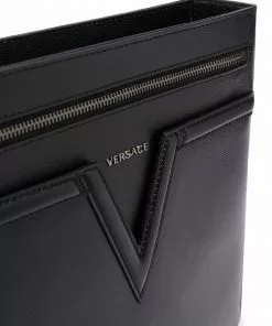 Versace embossed-logo leather messenger bag