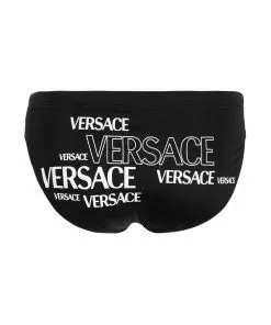 Versace repeated logo-print swimming trunks