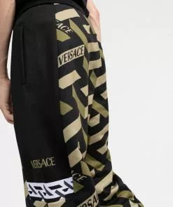 Versace Greca pattern logo print trousers 13 Versace Greca-pattern logo-print trousers